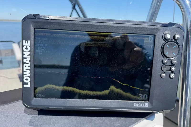 Slide: The Image of Fishfinder display on a 2018 Misty Harbor 210 RF boat, showing depth and sonar data. - 52