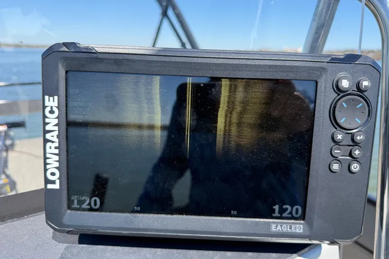 Slide: The Image of Lowrance Eagle9 fish finder on Misty Harbor 210 RF, 2018 model, with water background. - 53