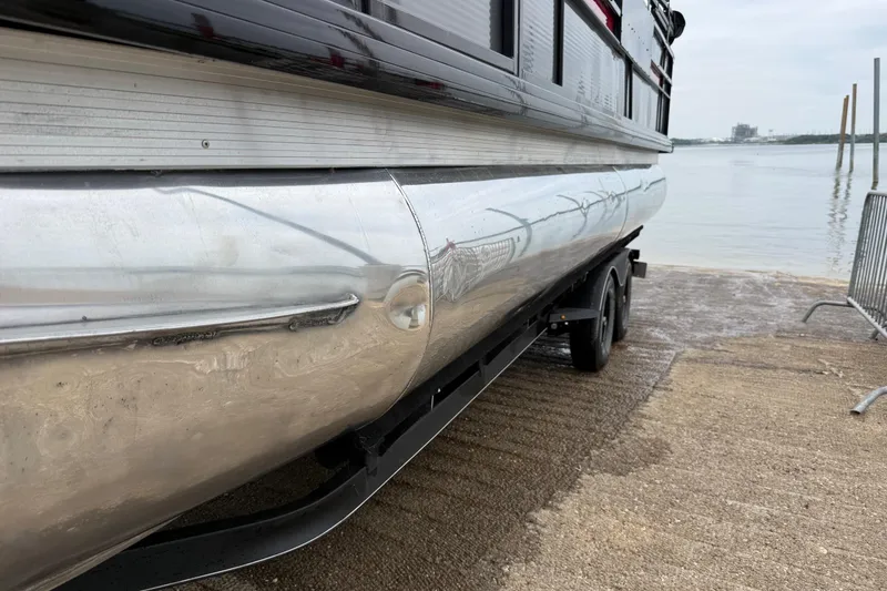 Slide: The Image of 2018 Misty Harbor 210 RF pontoon boat on trailer by waterfront. - 55