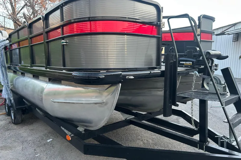 Slide: The Image of 2018 Misty Harbor 210 RF pontoon boat with Honda motor on trailer by the water. - 7