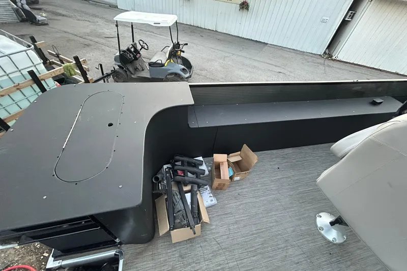 Slide: The Image of 2018 Misty Harbor 2285RF boat interior with equipment and boxes on deck. - 17