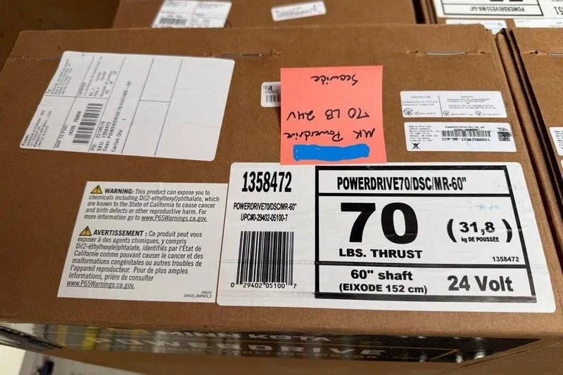 Slide: The Image of 2018 Misty Harbor 2285RF pontoon boat on trailer, parked near a tree and fence. - 2