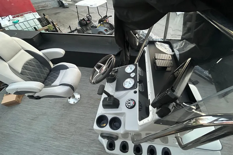 Slide: The Image of Captain's chair and control panel of 2018 Misty Harbor 2285RF boat. - 20