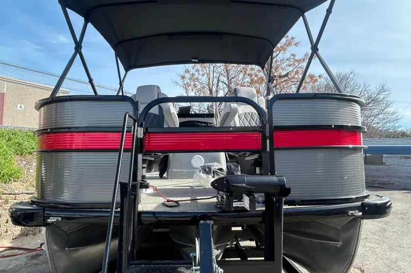 Slide: The Image of 2018 Misty Harbor 2285RF pontoon boat, rear view with red accents and canopy. - 30