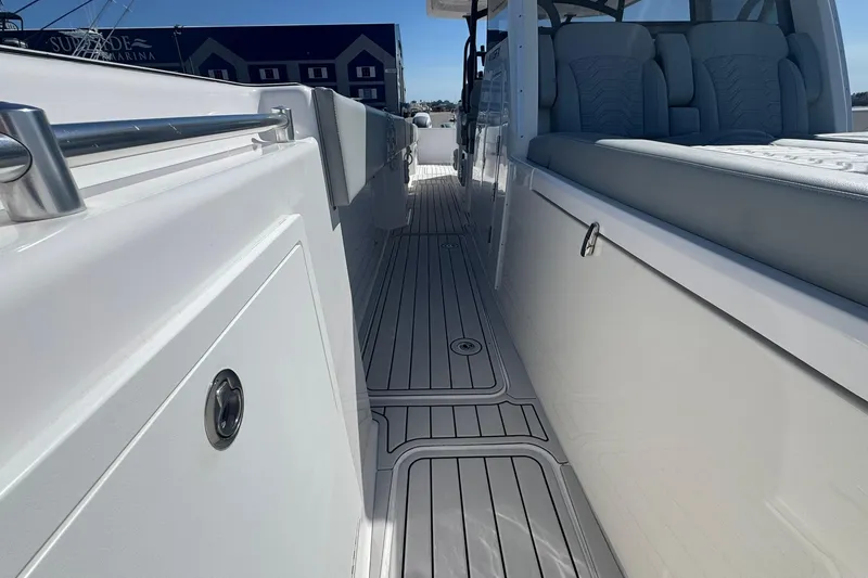 Slide: The Image of 2023 Twin Vee 400 GFX CC boat interior with sleek seating and modern design. - 11