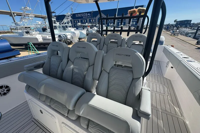 Slide: The Image of 2023 Twin Vee 400 GFX CC boat interior with luxurious seating at Surfside Marina. - 6