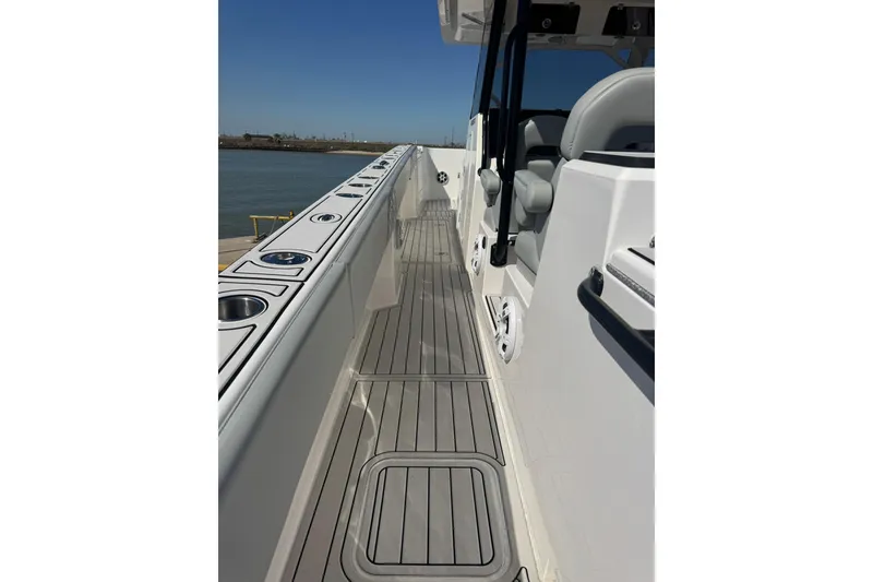 Slide: The Image of 2023 Twin Vee 400 GFX CC boat deck with sleek design and modern features. - 9