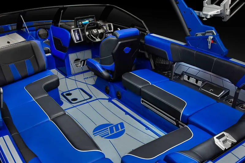 Slide: The Image of Manufacturer Provided Image: 2022 Malibu Wakesetter 23 LSV interior with blue and black seating, modern dashboard. - 4