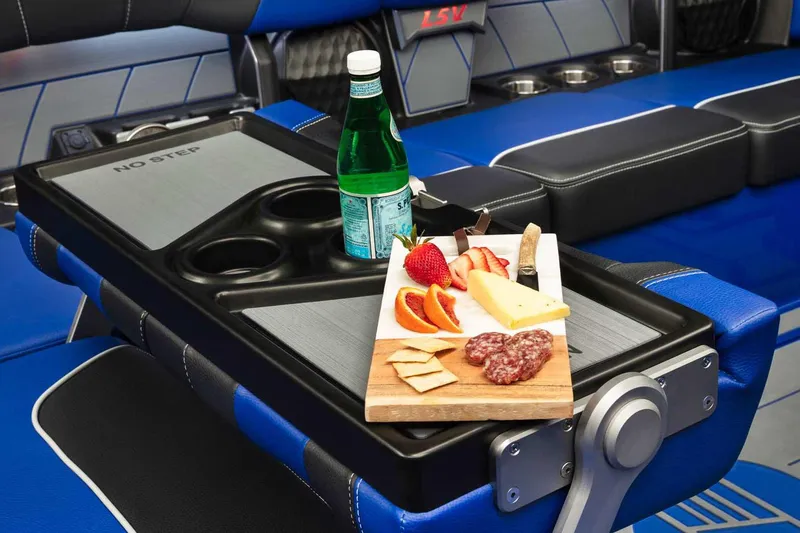 Slide: The Image of Manufacturer Provided Image: Charcuterie board and drink on 2022 Malibu Wakesetter 23 LSV boat's table. - 7