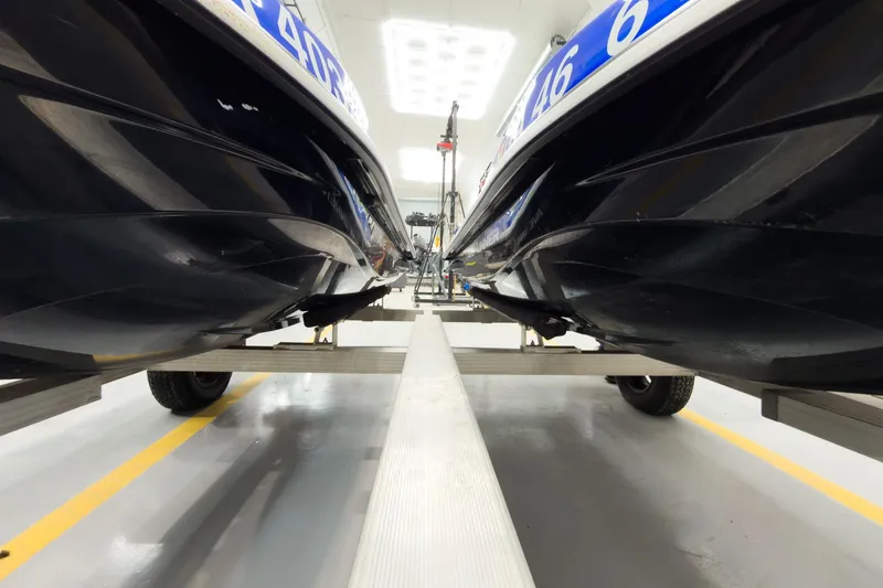 Slide: The Image of 2018 Yamaha WaveRunner EX Deluxe jet skis on a trailer in a bright garage. - 21