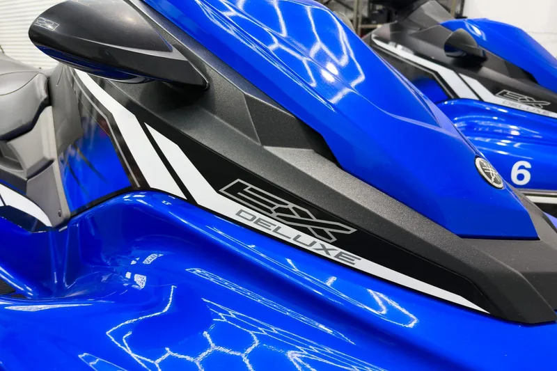 Slide: The Image of 2018 Yamaha WaveRunner EX Deluxe, blue with sleek design and branding details. - 8