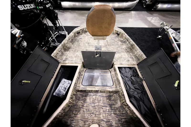 Slide: The Image of 2026 Excel 220 Bay Pro Elite boat interior with storage compartments and seating. - 12