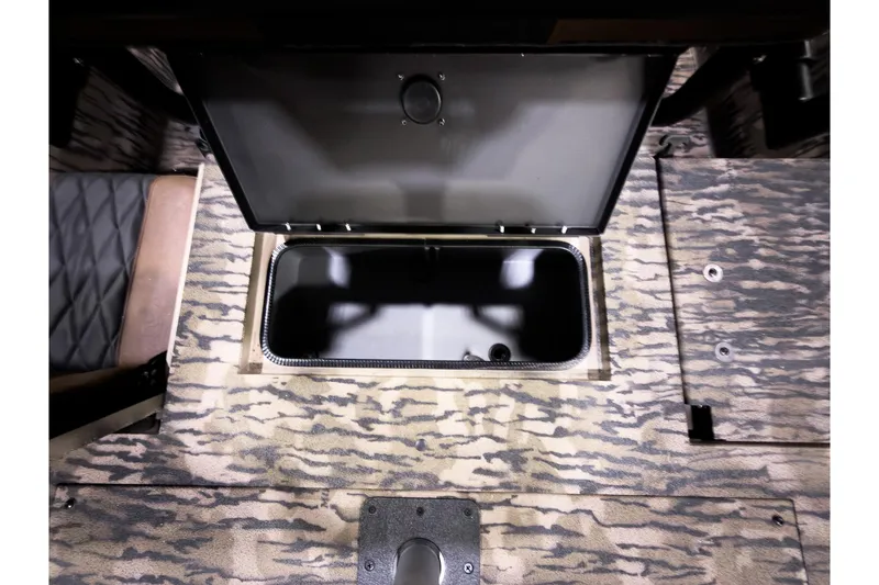 Slide: The Image of Open storage compartment in Excel 220 Bay Pro Elite 2026 boat. - 17