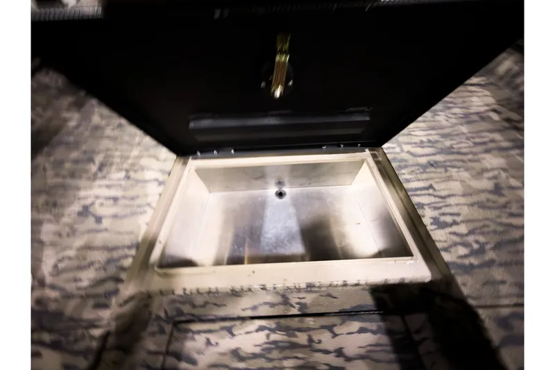 Slide: The Image of Open storage compartment in 2026 Excel 220 Bay Pro Elite boat. - 18