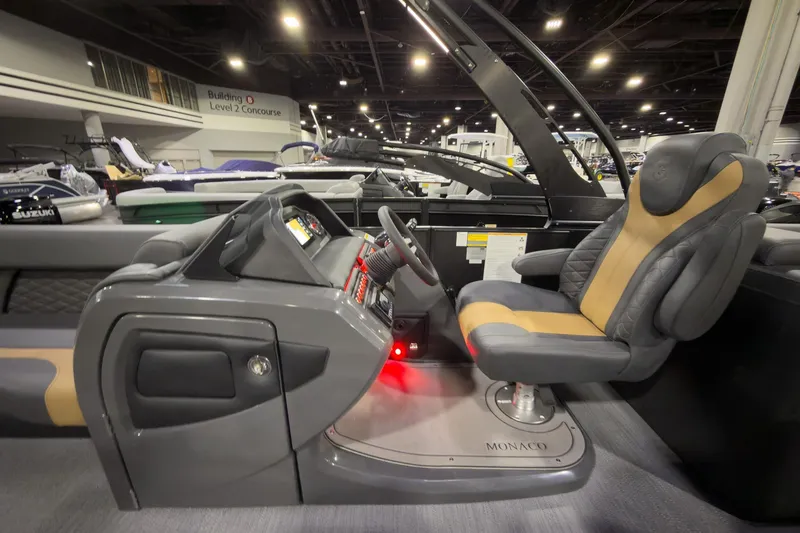 Slide: The Image of Interior of 2026 Godfrey Monaco 255 Ultra Lounge boat, featuring a modern helm and seating. - 12