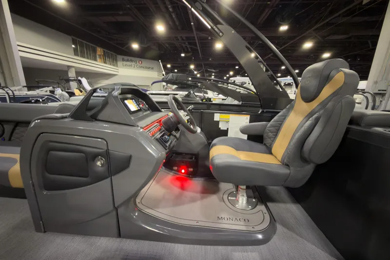Slide: The Image of 2026 Godfrey Monaco 255 Ultra Lounge boat interior with modern helm and luxurious seating. - 17
