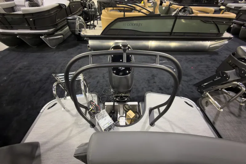 Slide: The Image of 2026 Godfrey Monaco 255 Ultra Lounge boat interior with modern seating and controls. - 27