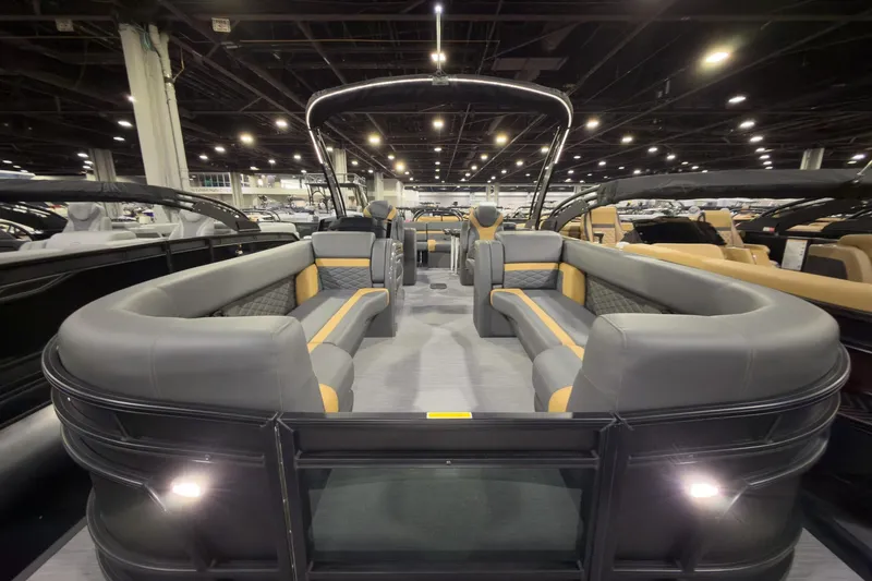 Slide: The Image of 2026 Godfrey Monaco 255 Ultra Lounge pontoon boat interior with luxurious seating and modern design. - 5