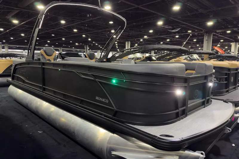 The Image of 2026 Godfrey Monaco 255 Ultra Lounge pontoon boat displayed indoors. - 0