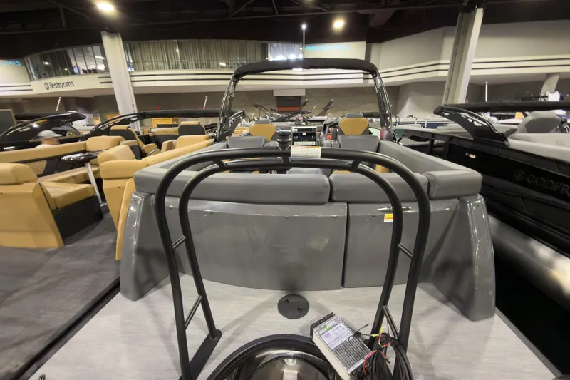 Slide: The Image of 2026 Godfrey Monaco 255 Ultra Lounge boat interior at an indoor showroom. - 30