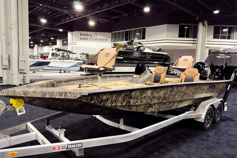 Slide: The Image of 2026 Excel EX203C Crappie & Bass boat on display at indoor exhibition. - 1
