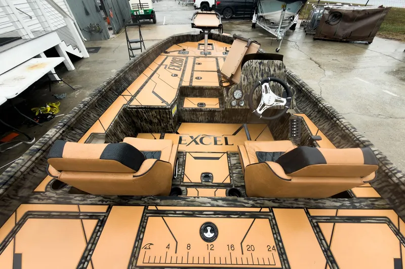 Slide: The Image of 2026 Excel EX203C Crappie & Bass boat with tan seats and camo accents. - 15