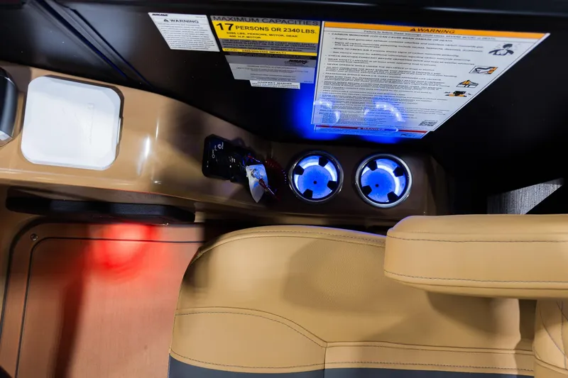 Slide: The Image of Interior of 2026 Godfrey Monaco 255 boat with illuminated cup holders and seating. - 13