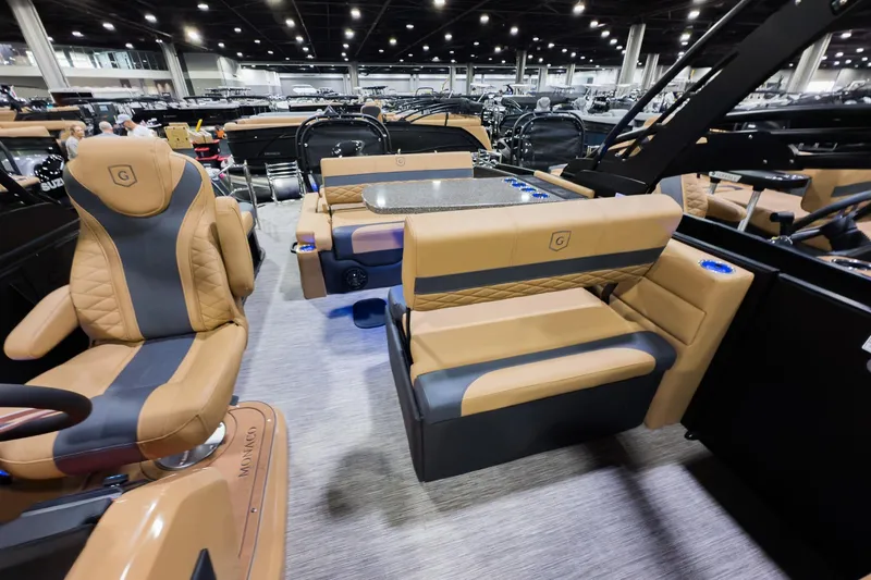 Slide: The Image of Luxurious interior of 2026 Godfrey Monaco 255 boat with tan and gray seating. - 15