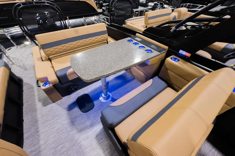 Slide: The Image of Luxurious interior of 2026 Godfrey Monaco 255 boat with elegant seating and table setup. - 17