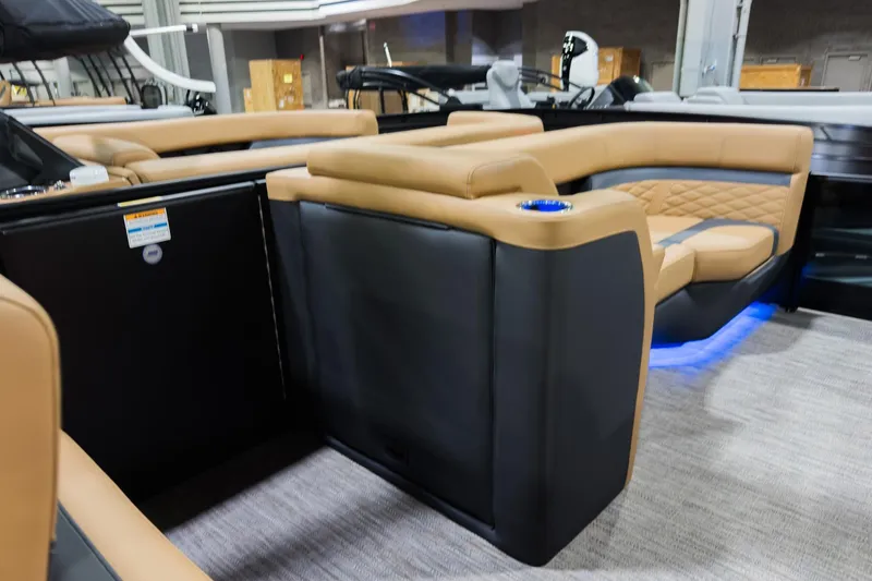 Slide: The Image of Luxurious interior of 2026 Godfrey Monaco 255 boat with tan seating and blue LED lighting. - 28