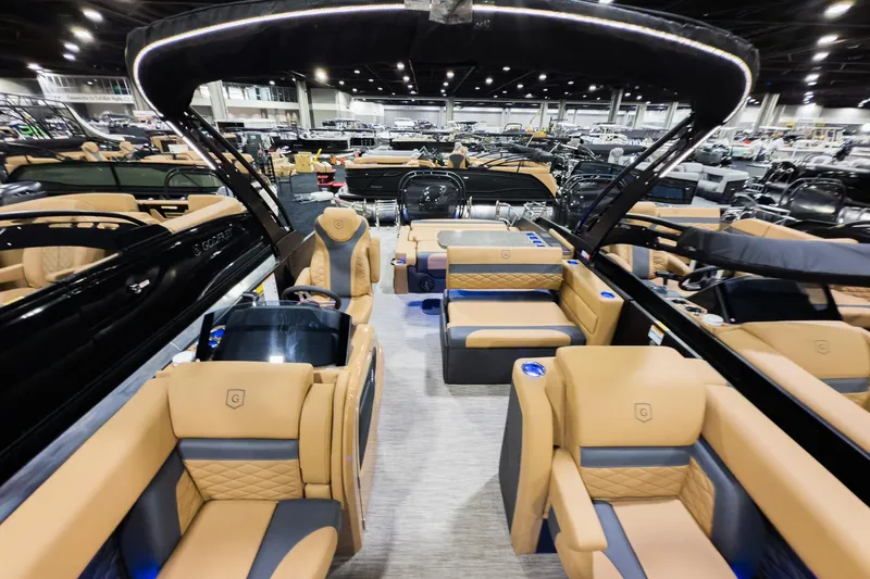 Slide: The Image of Luxurious 2026 Godfrey Monaco 255 boat interior with tan seating and modern design. - 5