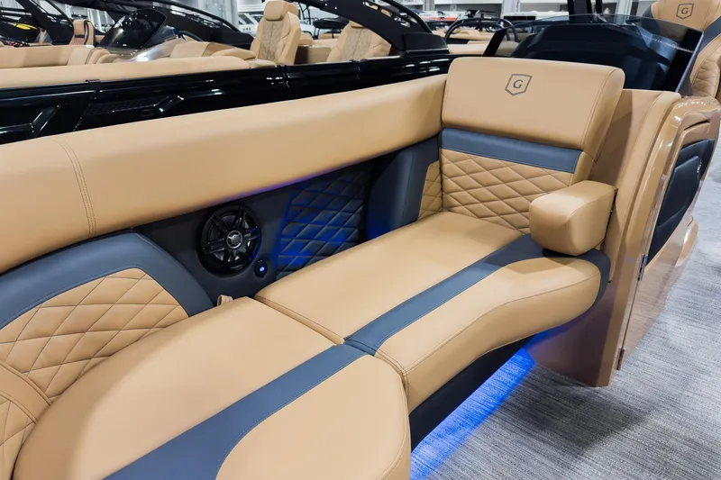 Slide: The Image of Luxurious seating on the 2026 Godfrey Monaco 255 Mid-Table Single Flip Lounge boat. - 7