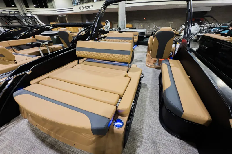 Slide: The Image of 2026 Godfrey Monaco 255 boat with luxurious tan seating and modern design. - 22