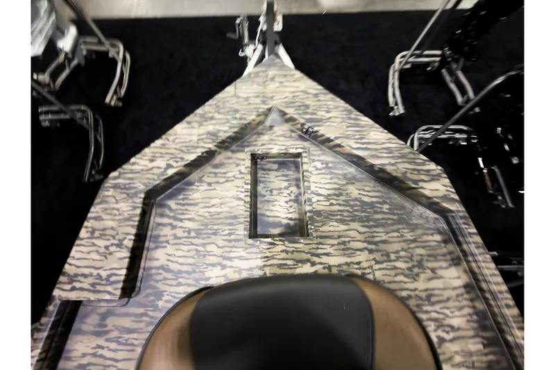 Slide: The Image of 2026 Excel 216 Stalker Center Console boat interior with camouflage pattern design. - 16