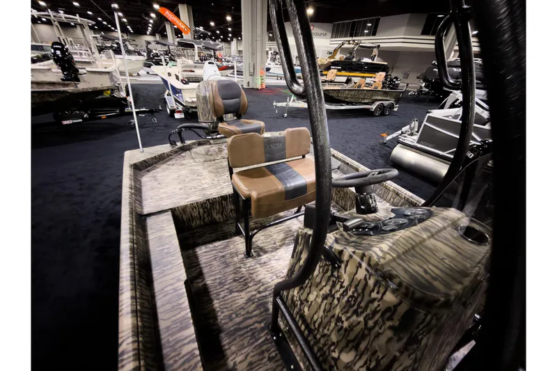 Slide: The Image of 2026 Excel 216 Stalker Center Console boat interior at a boat show. - 7