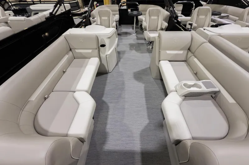 Slide: The Image of 2026 Godfrey Sweetwater Xperience 20' Split Bench Pontoon interior with plush seating and cup holders. - 29