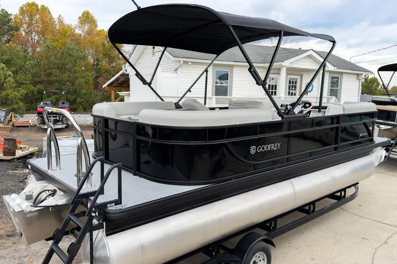 Slide: The Image of 2026 Godfrey Sweetwater Xperience 20' Split Bench Pontoon with black canopy and sleek design. - 3