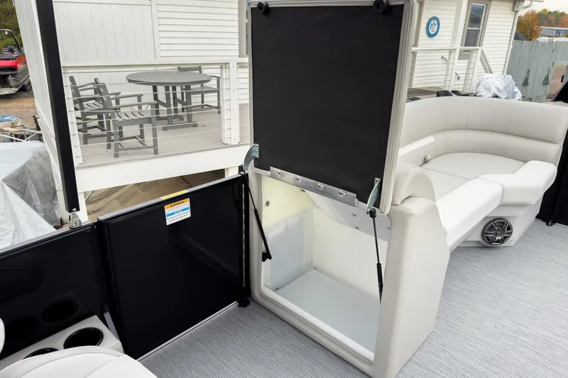 Slide: The Image of 2026 Godfrey Sweetwater Xperience 20' pontoon with split bench seating and storage compartment. - 20