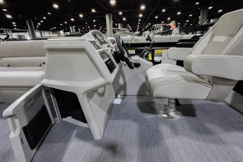Slide: The Image of 2026 Godfrey Sweetwater Xperience 20' pontoon interior with captain's chair and helm. - 35