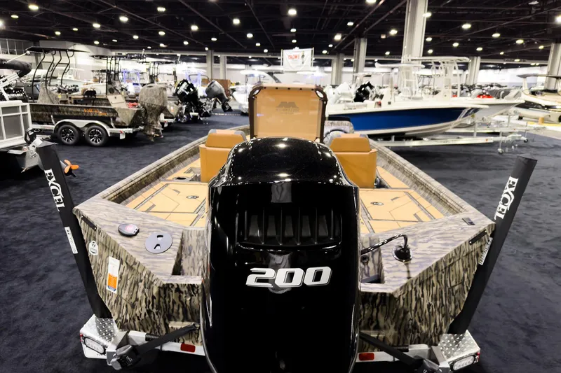 Slide: The Image of 2026 Excel EX203C Crappie & Bass boat displayed at an indoor boat show. - 3