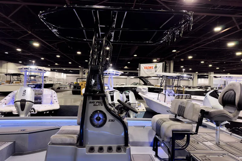 Slide: The Image of 2026 Excel 230 Bay Pro Elite boat showcased at an indoor exhibition. - 5