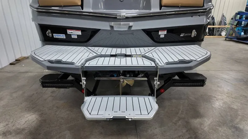 Slide: The Image of Rear view of 2026 MasterCraft XT23 with foldable swim platform. - 10