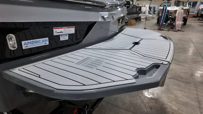 Slide: The Image of 2026 MasterCraft XT23 boat with gray rear deck. - 11