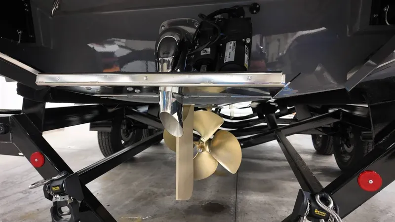 Slide: The Image of Underside of a 2026 MasterCraft XT23 boat showing propeller view. - 12