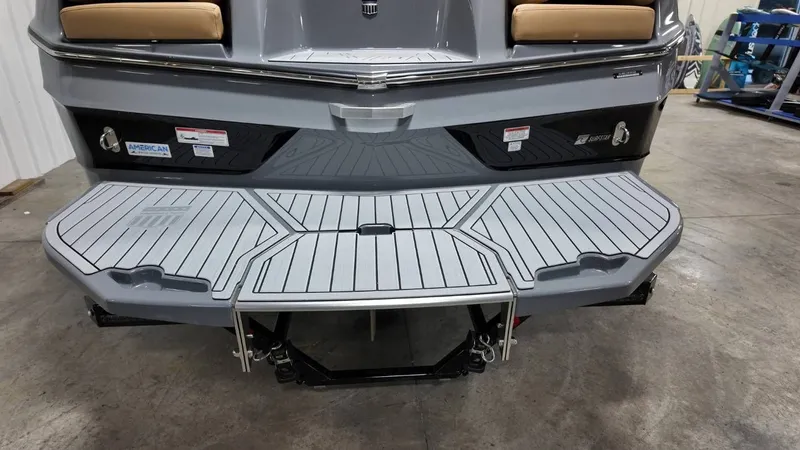 Slide: The Image of Rear view of 2026 MasterCraft XT23 boat with gray deck. - 14