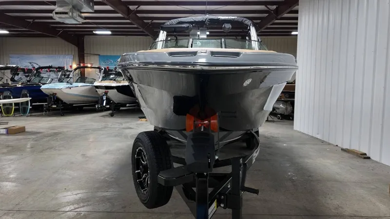Slide: The Image of 2026 MasterCraft XT23 boat in a storage facility. - 19