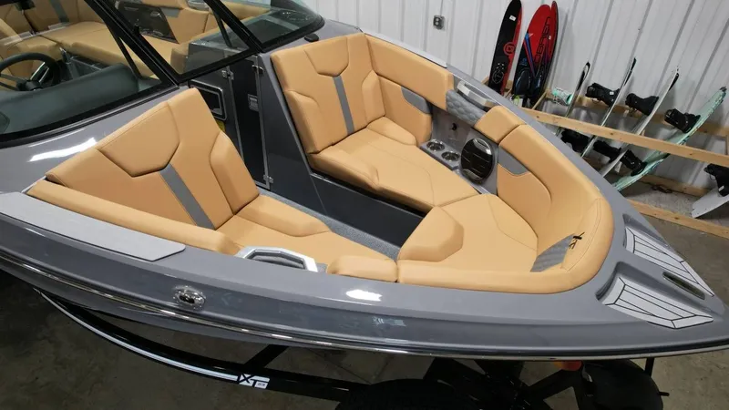 Slide: The Image of Interior of 2026 MasterCraft XT23 with beige seating. - 21