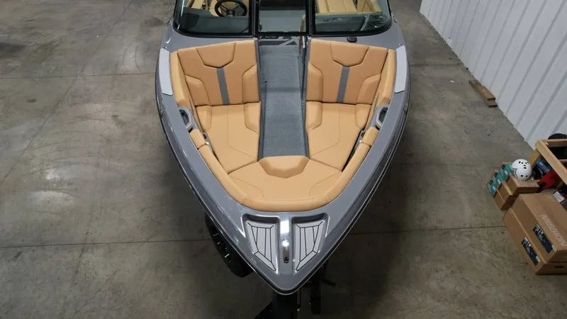 Slide: The Image of 2026 MasterCraft XT23 boat with beige interior, top view. - 24