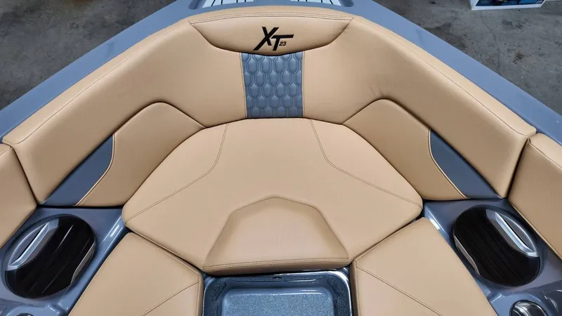 Slide: The Image of Interior of 2026 MasterCraft XT23 with beige upholstery. - 26