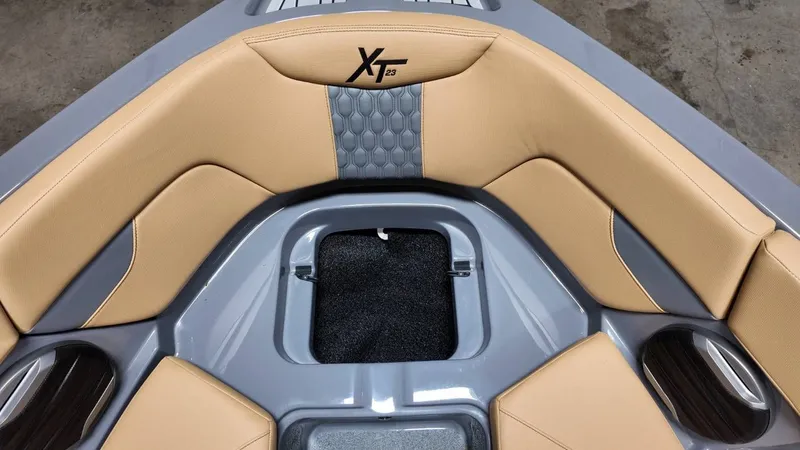Slide: The Image of Interior of 2026 MasterCraft XT23 boat with beige upholstery. - 28